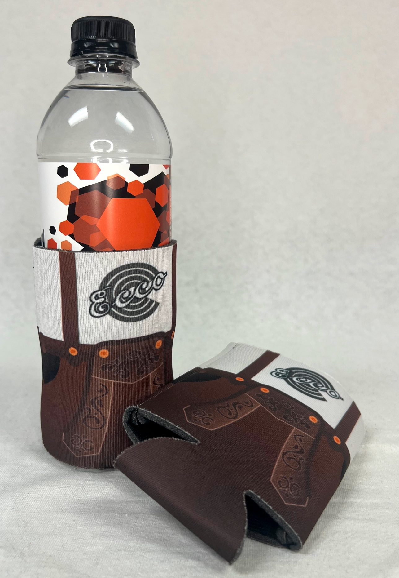 Ecco Lounge Lederhosen Koozie on water bottle and laid flat